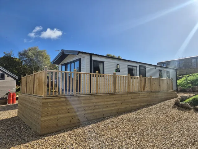 Manor side view caravan with decking
